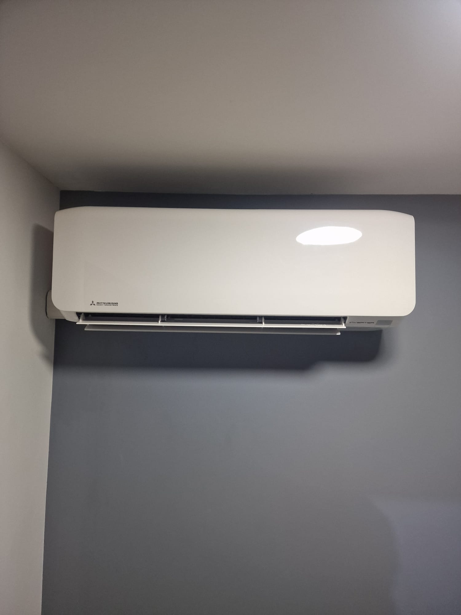 Wall mounted AC on brick feature wall